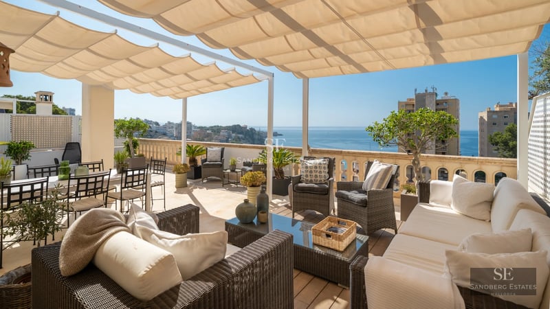 View of modern villa with infinity pool, stylish loungers, lush garden, and large windows. Minimalist architecture and luxurious finishes.