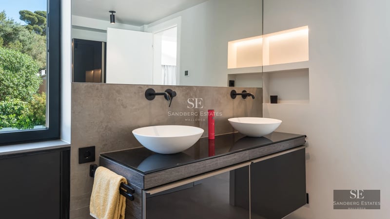 Exterior view of a modern villa with infinity pool. Minimalist design, manicured garden, and unobstructed views. Warm lighting.