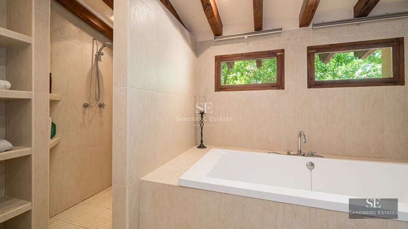 Expansive terrace featuring infinity pool. Ocean view. Modern design with sun loungers & umbrellas. Open spaces.