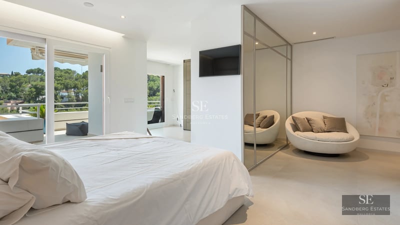 Exterior view of a modern villa with a pool, terrace, and large windows. Minimalist and elegant design with lush greenery.