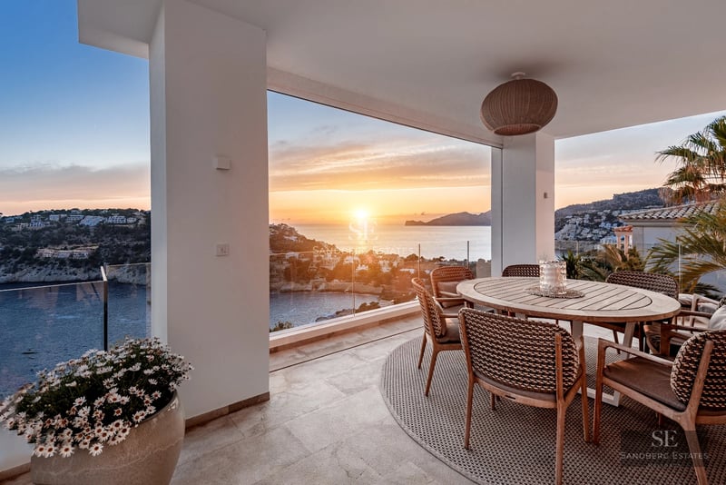 Exterior view of a modern house featuring a pool, terraces, and a large garden. Contemporary architecture with large windows and minimalist design.
