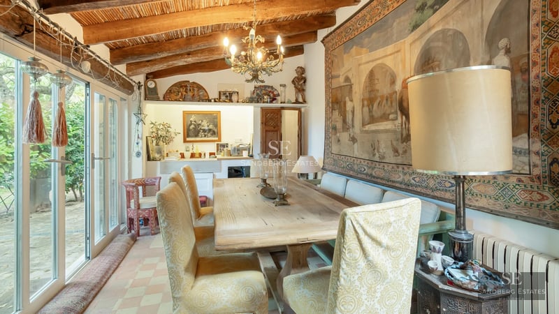 Spacious terrace with infinity pool, sun loungers, and sea view. Modern design featuring sleek glass railings.