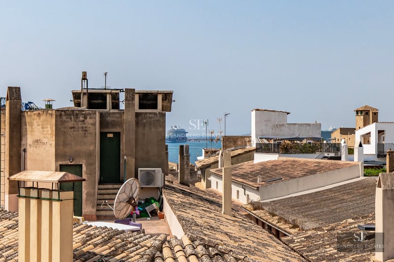 Spacious balcony with panoramic sea views. Modern design with glass railing. Bright and elegant interior.