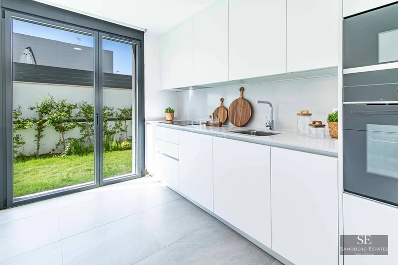 Stunning sea view from terrace with infinity pool. Modern, elegant design with glass railing.