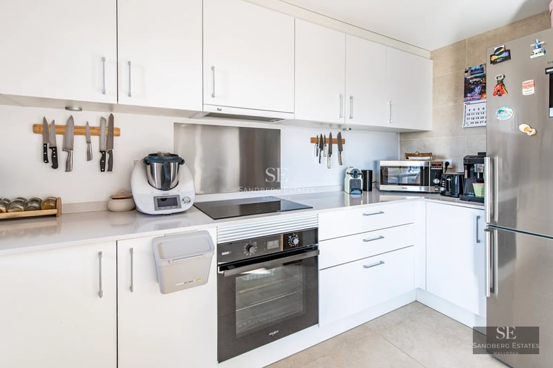 Image of a modern villa featuring an infinity pool, landscaped garden, large windows, and a spacious terrace.