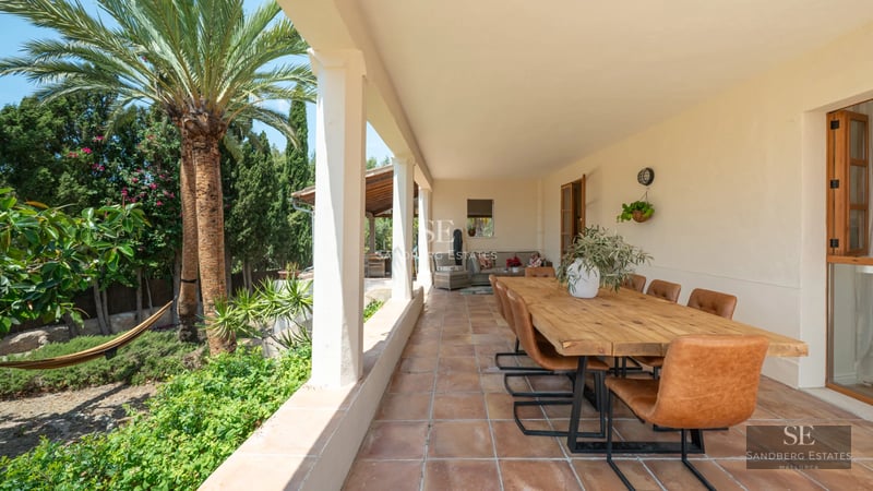 Exterior view of a modern villa with pool, lush garden, and spacious terraces. Minimalist architecture, perfect for relaxation.