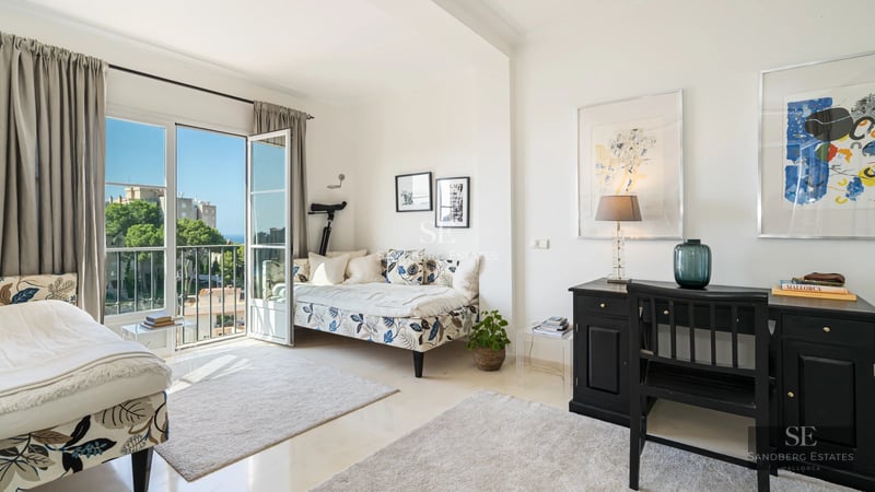 Exterior view of a modern villa with an infinity pool, lush garden, and minimalist architecture. Ambient lighting.