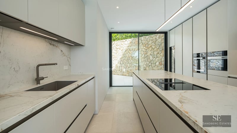 Spacious terrace with pool, sun loungers, and garden views. Modern, elegant, and bright architecture. Ideal for enjoying the outdoors.