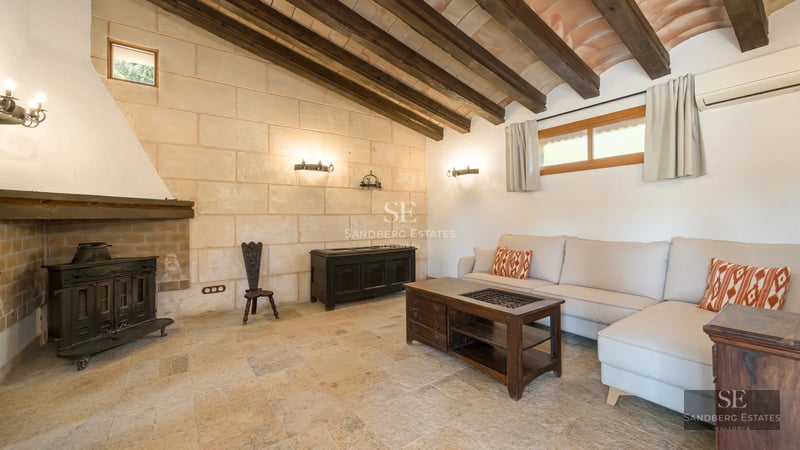 Exterior of a modern villa featuring a reflective pool, large windows, and manicured landscaping. Soft ambient lighting.