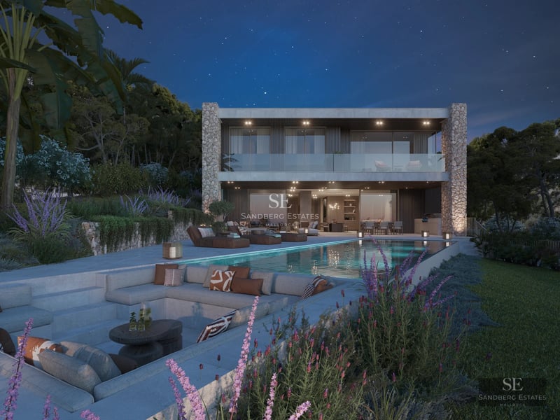 Spacious balcony with sea view. Modern grey and white furniture. Glass railing offers unobstructed views. Minimalist design.