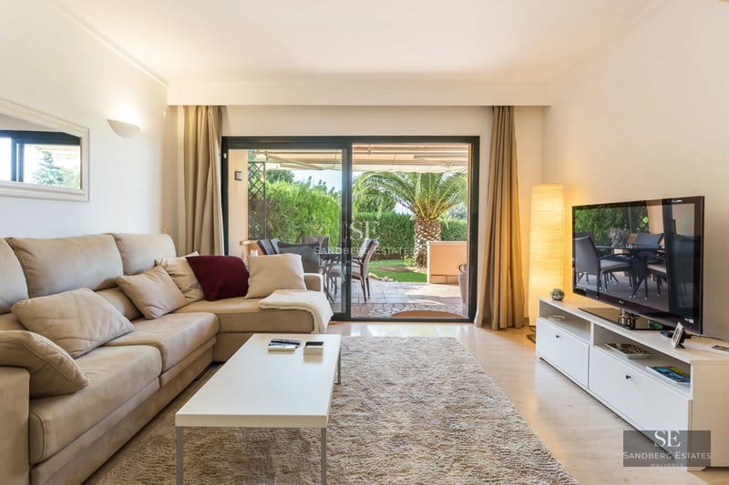 Exterior view of a modern villa featuring an infinity pool, lush greenery, and minimalist architecture. Sleek design with natural light.