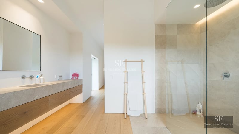 Large terrace with pool, sun loungers, and seating area. Modern, minimalist and elegant design. Panoramic views. Natural lighting.