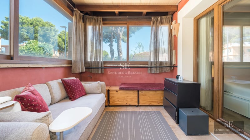 View of a modern villa with infinity pool, surrounded by greenery. Minimalist architecture, clean lines, and large windows.