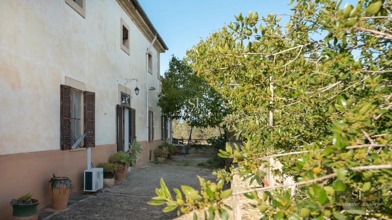 Spacious terrace with pool and panoramic views. Modern design with natural lighting. Elegant outdoor furniture and lush vegetation.