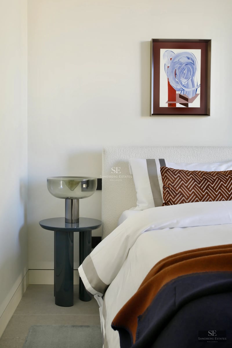 Exterior view of a modern villa with an infinity pool, large windows, and lush gardens. Minimalist architecture with wooden accents.