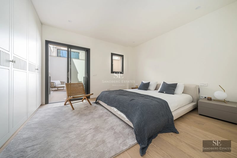 Spacious balcony with glass railing and panoramic sea views. Modern and stylish outdoor furniture. High-quality finishes throughout.