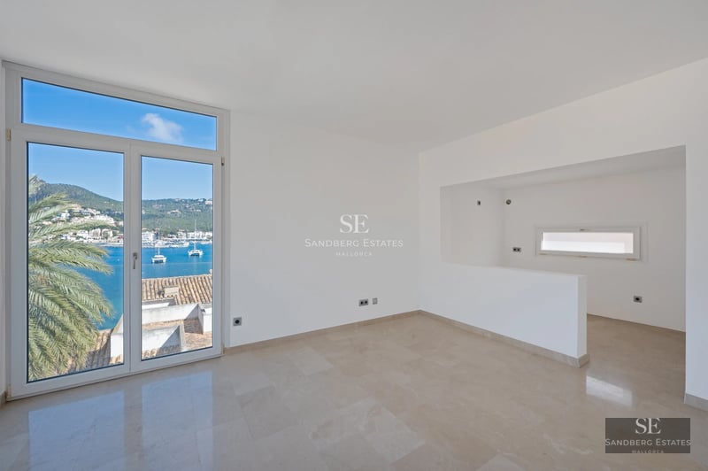 View of a luxurious villa with pool and lush garden. Modern architecture with large windows and elegant design.