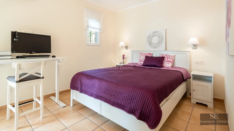 Spacious living room featuring panoramic windows, designer furniture, light wood flooring and stunning Mediterranean sea views.