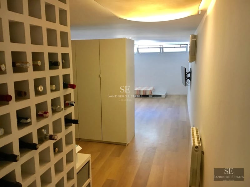 Spacious terrace featuring an infinity pool and ocean views. Minimalist design, modern furniture, and lush vegetation.