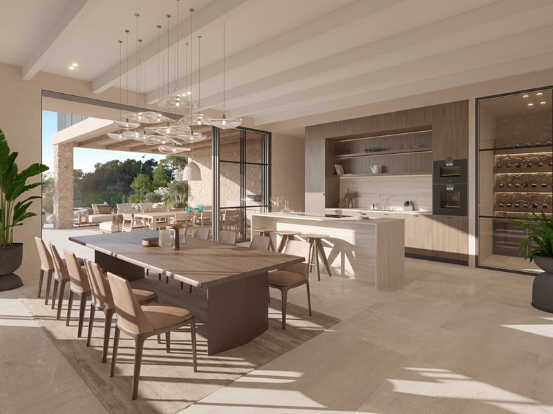 Cuisine contemporaine avec îlot en pierre, table en bois et baies vitrées s'ouvrant sur une terrasse.