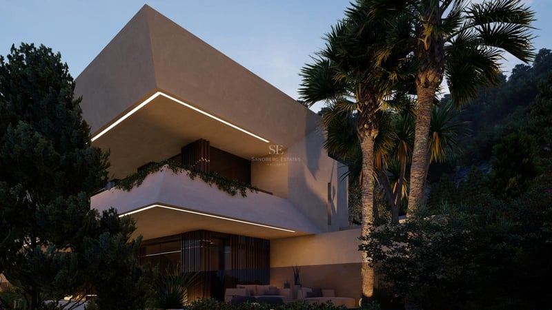 Dusk shot of a multi-level contemporary villa with geometric concrete balconies and integrated warm LED lighting.