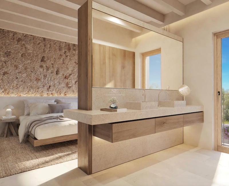 Chambre de maître moderne avec double vasque en pierre intégrée, mur en pierre rustique et plafond à poutres.