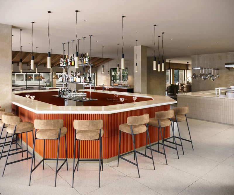 Bar hexagonal élégant avec comptoir en pierre blanche, base orange nervurée et tabourets beiges sous suspensions.