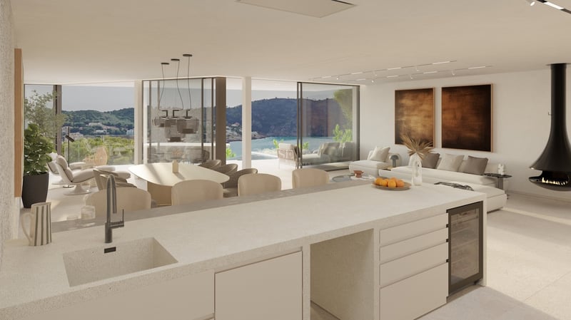 Großzügiges, offenes Wohnzimmer mit Küche, hängendem Kamin und großen Glasfronten mit Blick auf das Meer.