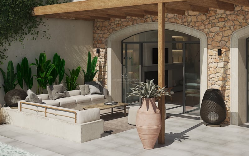 Salon de jardin luxueux avec canapé intégré, pergola en bois et mur en pierre naturelle sous le soleil.