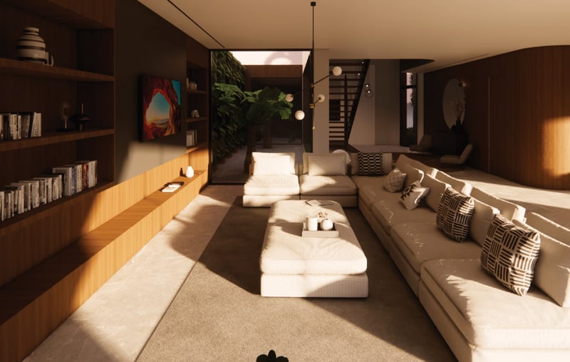 Salon moderne avec grand canapé crème, bibliothèque en bois intégrée et patio intérieur avec végétation.