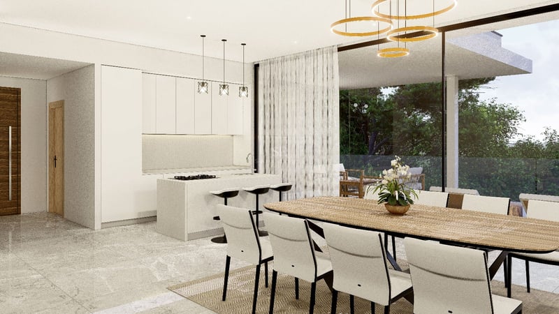 Salle à manger moderne avec table en bois et chaises blanches, cuisine minimaliste et vue sur la terrasse.