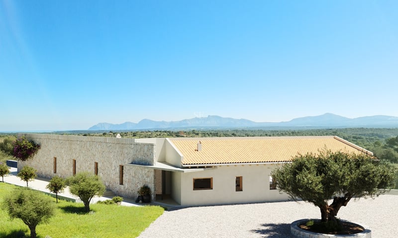Villa moderne de plain-pied avec murs en pierre naturelle, toit en terre cuite et oliviers sur fond de montagnes.