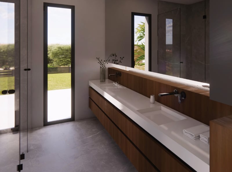 Salle de bains moderne avec double vasque suspendue en bois, sol en pierre grise et porte vitrée.