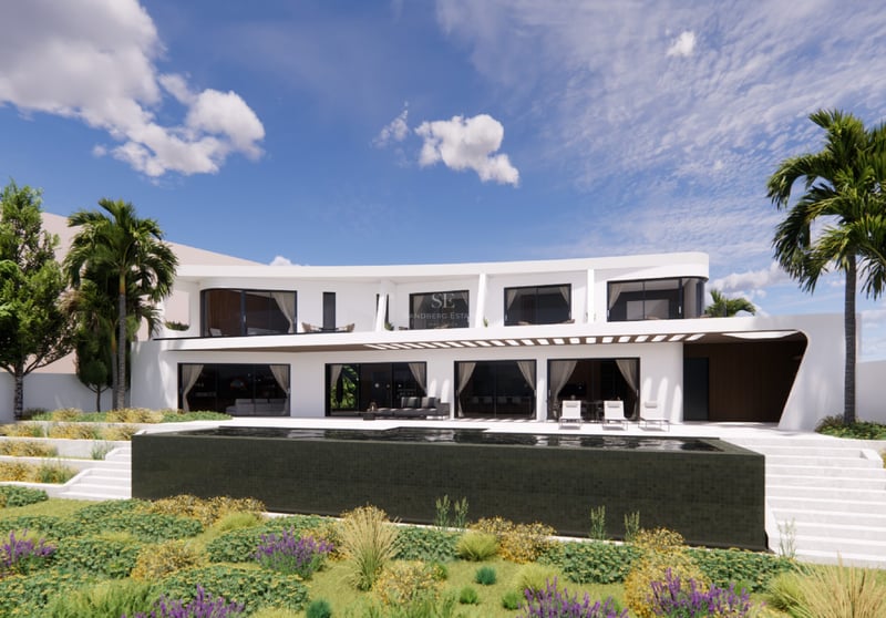 Villa blanche à deux étages, architecture courbe, piscine à débordement en carrelage sombre et jardin paysager.