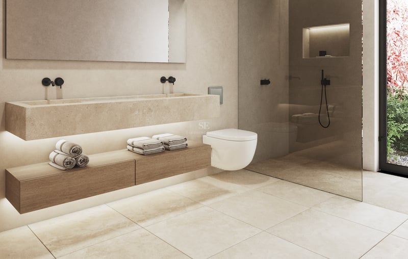 Salle de bains moderne avec vasque en pierre, robinetterie noir mat et douche à l'italienne vitrée.