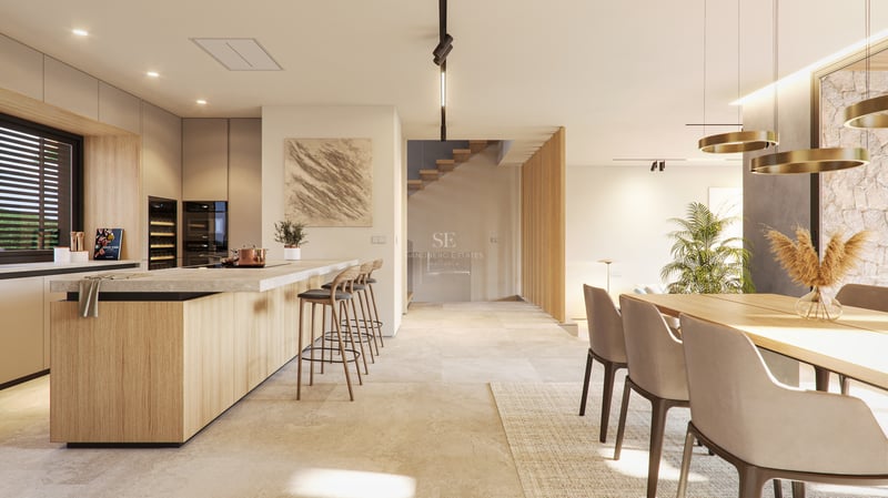Contemporary kitchen featuring a wooden breakfast bar, natural stone floors, and a minimalist staircase.