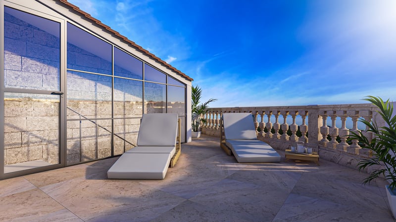A spacious rooftop terrace featuring two modern sun loungers, natural stone flooring, and an ornate stone balustrade.